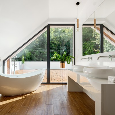 Elegant attic bathroom with bathtub